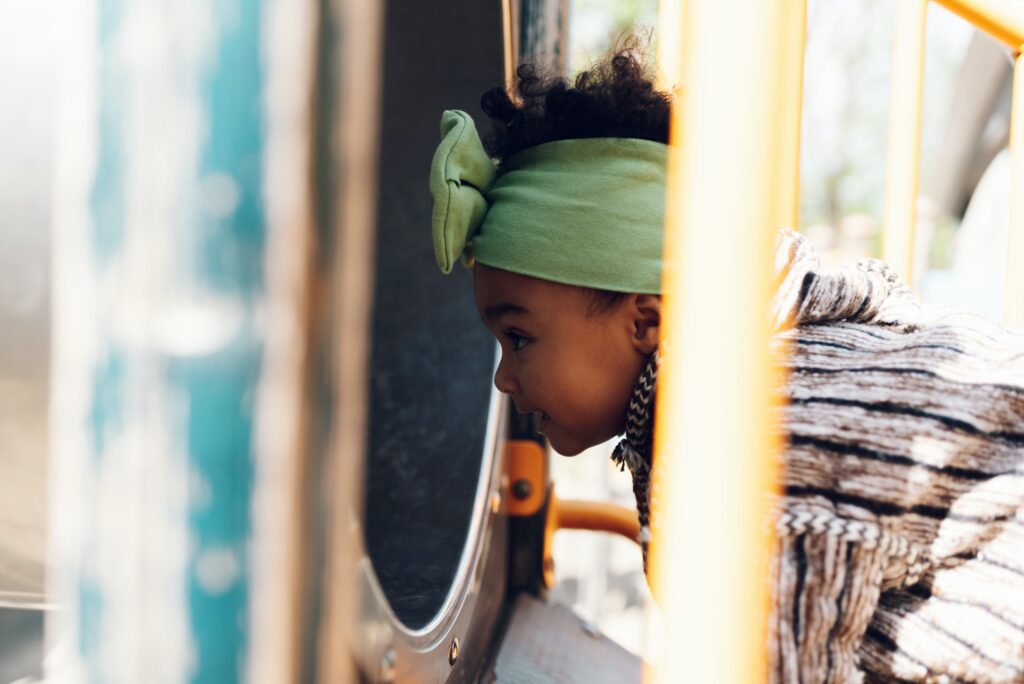 African american baby girl playing on an outdoor playground